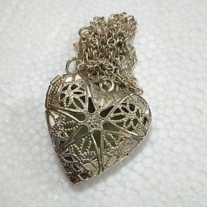Silver tone laser cut heart locket